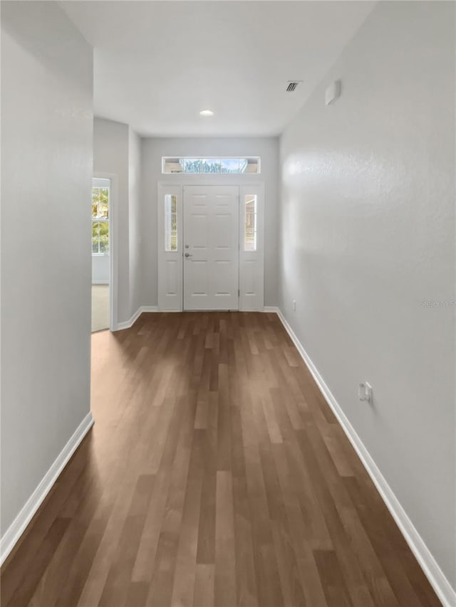 6303 Twin Bridges Dr, Zephyrhills, FL 33541 - foyer entrance featuring wood finished floors