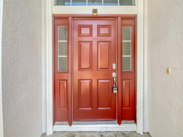 6303 Twin Bridges Dr, Zephyrhills, FL 33541 - view of exterior entry with stucco siding