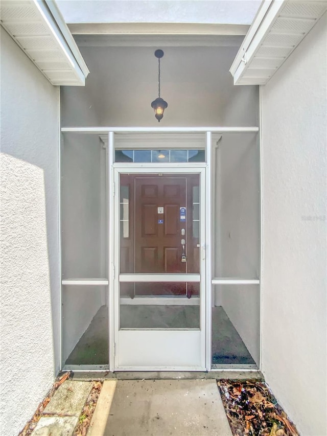 6303 Twin Bridges Dr, Zephyrhills, FL 33541 - doorway to property with stucco siding