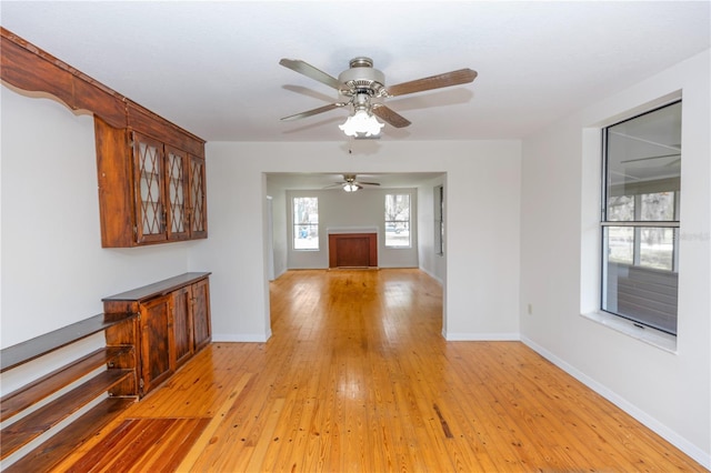 19402 E 5th St, Umatilla, FL 32784 - hall with light wood finished floors and baseboards