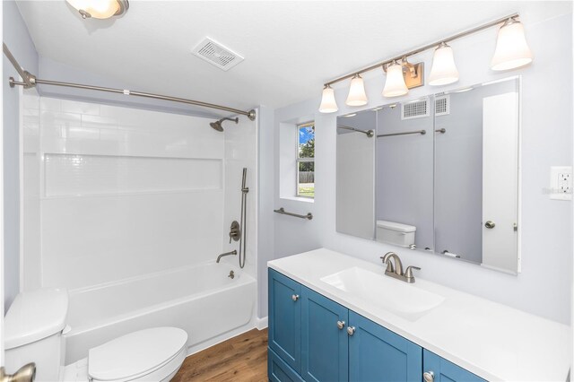 19402 E 5th St, Umatilla, FL 32784 - full bathroom featuring wood finished floors, shower / bath combination, and vanity