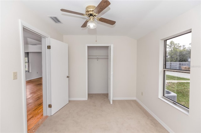 19402 E 5th St, Umatilla, FL 32784 - unfurnished bedroom with carpet flooring, a ceiling fan, and a closet