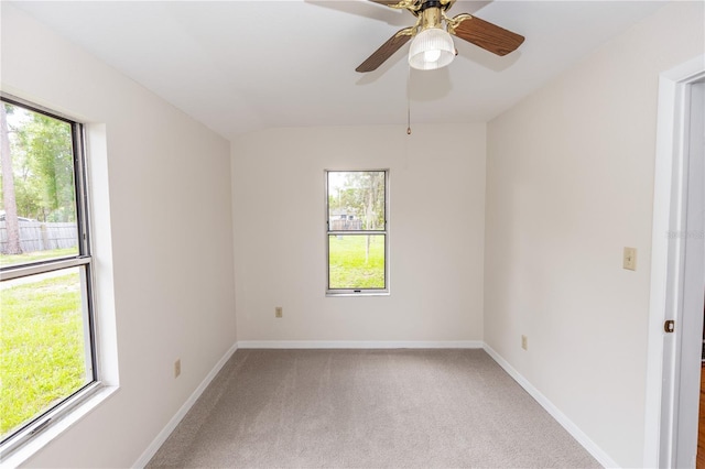 19402 E 5th St, Umatilla, FL 32784 - spare room featuring light carpet and a ceiling fan