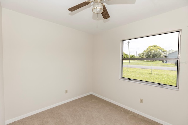 19402 E 5th St, Umatilla, FL 32784 - unfurnished room featuring light colored carpet and a ceiling fan