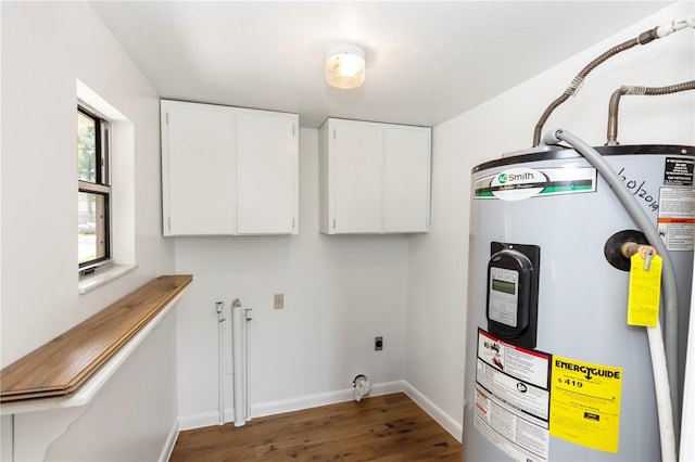 19402 E 5th St, Umatilla, FL 32784 - laundry room featuring water heater, cabinet space, dark wood-style floors, and electric dryer hookup