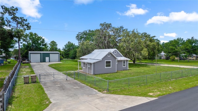 19402 E 5th St, Umatilla, FL 32784 - view of front of house featuring a gate, a garage, an outbuilding, and a fenced front yard