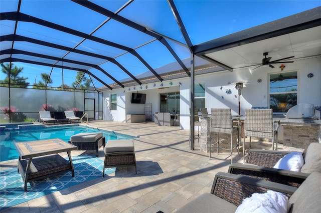 8998 Croquet Ct, Champions Gate, FL 33896 - view of patio featuring ceiling fan, outdoor lounge area, a bar, a pool with connected hot tub, and glass enclosure