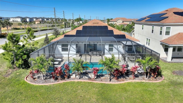 8998 Croquet Ct, Champions Gate, FL 33896 - back of property featuring a yard, a lanai, and an outdoor pool