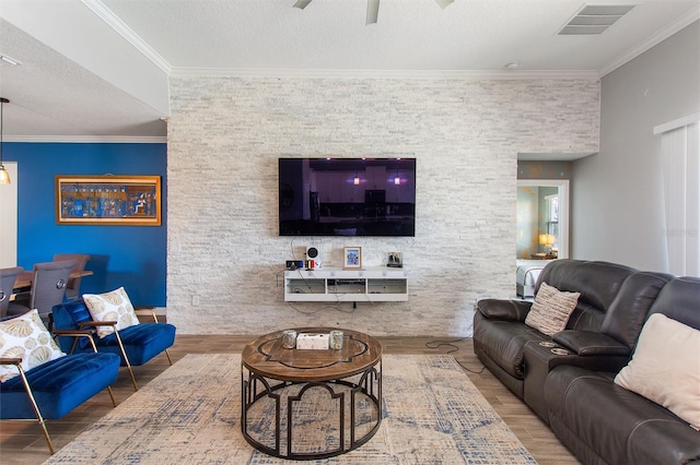 8998 Croquet Ct, Champions Gate, FL 33896 - living room featuring wood finished floors, ceiling fan, and crown molding
