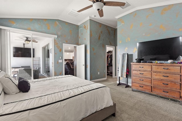 8998 Croquet Ct, Champions Gate, FL 33896 - bedroom with crown molding, vaulted ceiling, wallpapered walls, light colored carpet, and a walk in closet