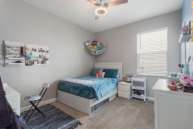 8998 Croquet Ct, Champions Gate, FL 33896 - bedroom with light colored carpet and ceiling fan