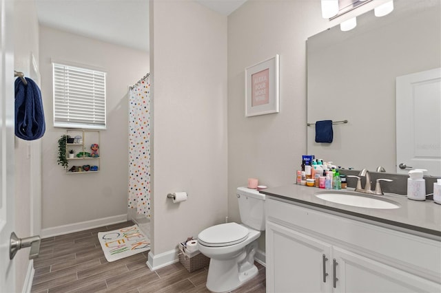 8998 Croquet Ct, Champions Gate, FL 33896 - bathroom with vanity, wood finished floors, and curtained shower