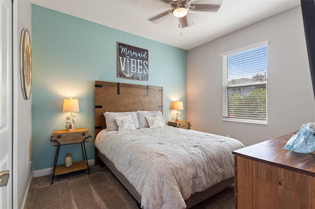 8998 Croquet Ct, Champions Gate, FL 33896 - bedroom featuring dark carpet and ceiling fan