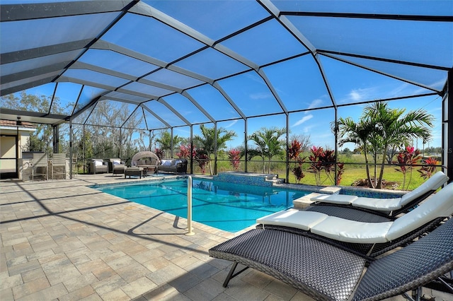 8998 Croquet Ct, Champions Gate, FL 33896 - view of pool with a patio, glass enclosure, and a pool with connected hot tub