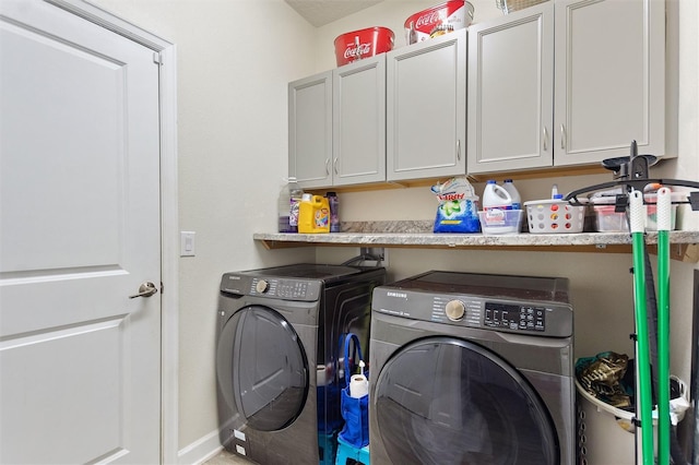 8998 Croquet Ct, Champions Gate, FL 33896 - laundry area with washer and dryer and cabinet space