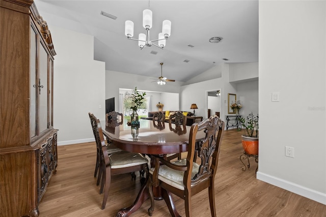 12404 SW 31st Ave, Archer, FL 32618 - dining room with light wood-type flooring, vaulted ceiling, a chandelier, and a ceiling fan