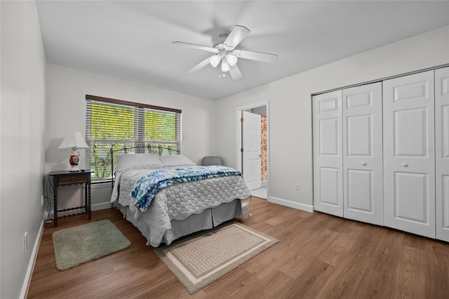 12404 SW 31st Ave, Archer, FL 32618 - bedroom featuring wood finished floors, a closet, a ceiling fan, and connected bathroom