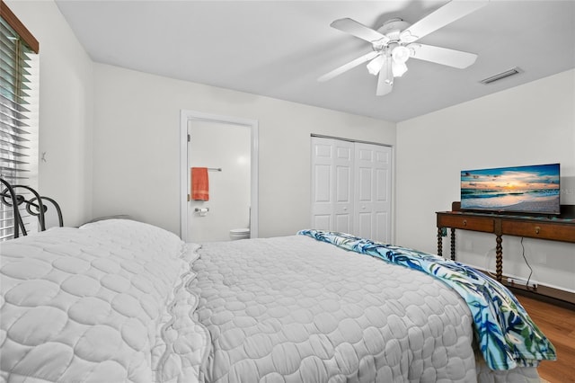 12404 SW 31st Ave, Archer, FL 32618 - bedroom featuring wood finished floors, a closet, ensuite bath, and ceiling fan