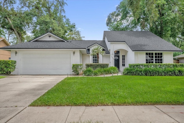 1237 Erik Ct, Altamonte Springs, FL 32714 - single story home with a shingled roof, a garage, and stucco siding