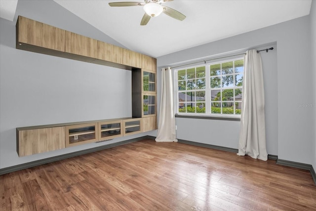 1237 Erik Ct, Altamonte Springs, FL 32714 - empty room with vaulted ceiling, hardwood / wood-style flooring, and ceiling fan