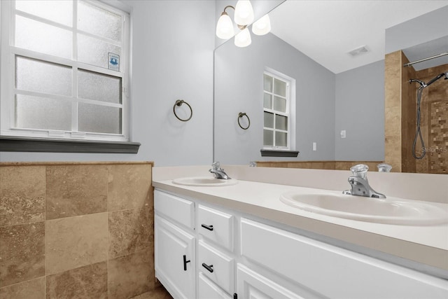 1237 Erik Ct, Altamonte Springs, FL 32714 - bathroom with double vanity and a tile shower