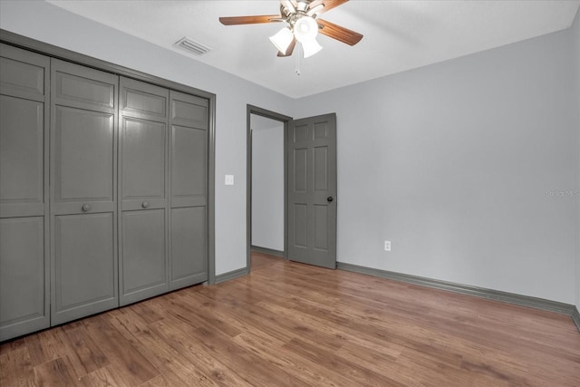 1237 Erik Ct, Altamonte Springs, FL 32714 - unfurnished bedroom with light wood-style floors, a closet, and ceiling fan