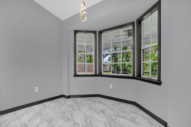 1237 Erik Ct, Altamonte Springs, FL 32714 - empty room featuring vaulted ceiling and light marble finish flooring