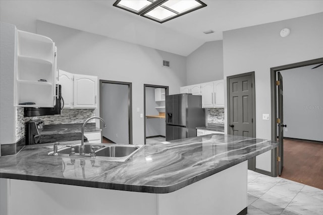 1237 Erik Ct, Altamonte Springs, FL 32714 - kitchen featuring refrigerator with ice dispenser, a peninsula, white cabinets, open shelves, and high vaulted ceiling