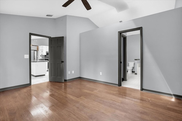 1237 Erik Ct, Altamonte Springs, FL 32714 - unfurnished room with vaulted ceiling, ceiling fan, and wood finished floors