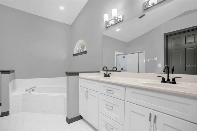 1237 Erik Ct, Altamonte Springs, FL 32714 - full bath featuring lofted ceiling, a stall shower, a bath, double vanity, and tile patterned floors