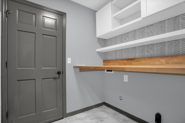 1237 Erik Ct, Altamonte Springs, FL 32714 - laundry area featuring baseboards and light marble finish floors