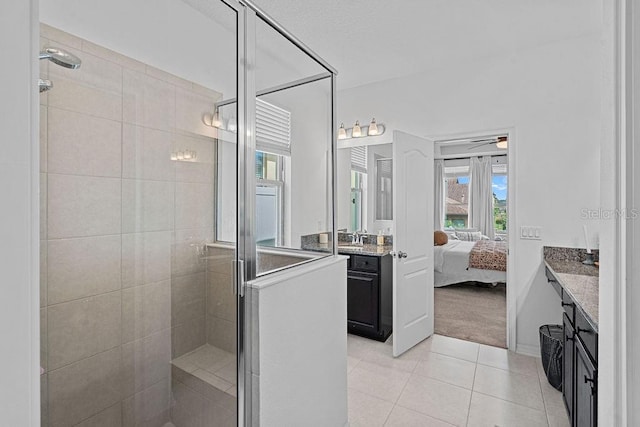1193 Woods Landing Dr, Minneola, FL 34715 - bathroom featuring a shower stall, vanity, tile patterned floors, ensuite bathroom, and a ceiling fan