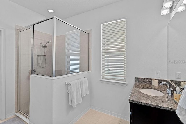 1193 Woods Landing Dr, Minneola, FL 34715 - bathroom featuring vanity, a shower stall, and tile patterned flooring