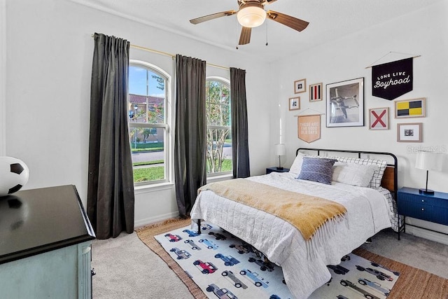 1193 Woods Landing Dr, Minneola, FL 34715 - bedroom with light colored carpet, multiple windows, and a ceiling fan