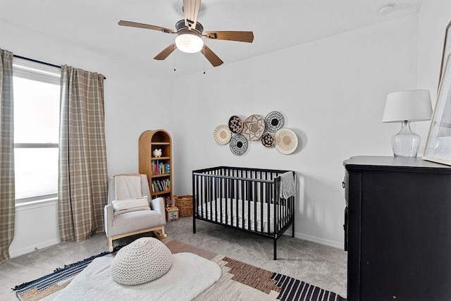 1193 Woods Landing Dr, Minneola, FL 34715 - carpeted bedroom with a crib and ceiling fan