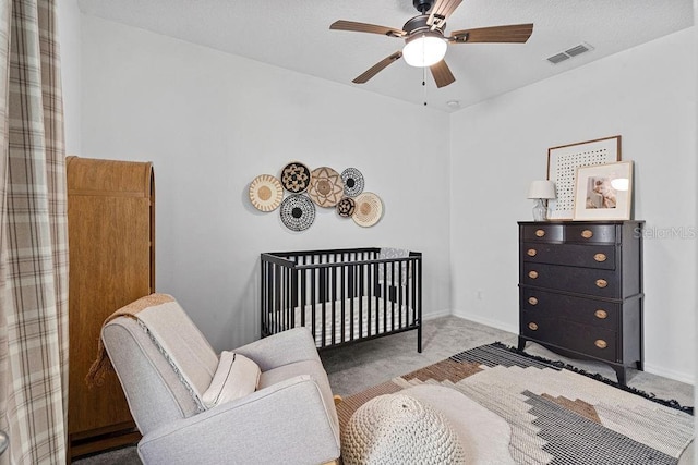 1193 Woods Landing Dr, Minneola, FL 34715 - carpeted bedroom with a nursery area and ceiling fan