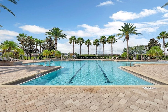 1193 Woods Landing Dr, Minneola, FL 34715 - community pool featuring a patio area