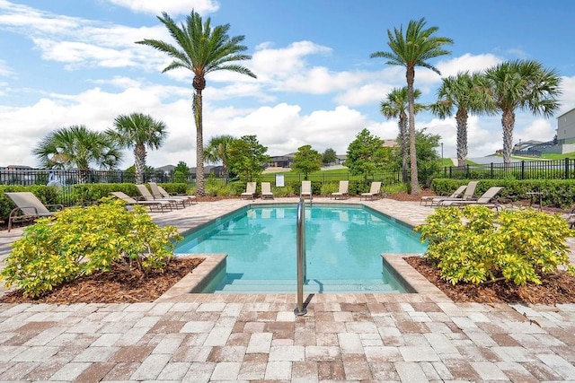 1193 Woods Landing Dr, Minneola, FL 34715 - community pool featuring a patio