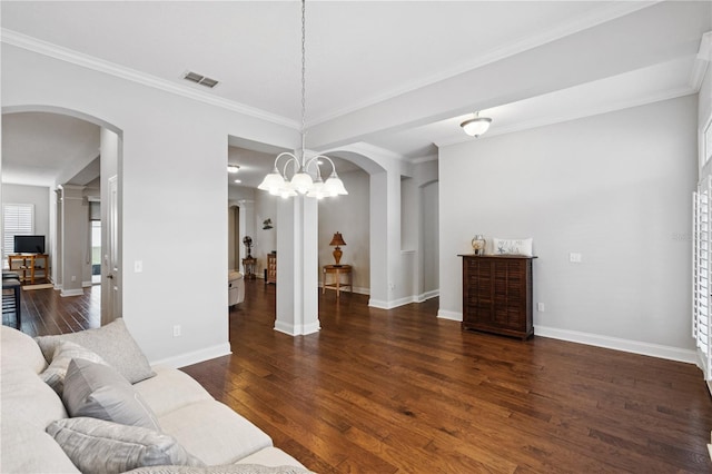 16415 Good Hearth Blvd, Clermont, FL 34711 - living area featuring arched walkways, wood finished floors, and crown molding