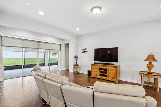 16415 Good Hearth Blvd, Clermont, FL 34711 - living area with wood finished floors, recessed lighting, and arched walkways