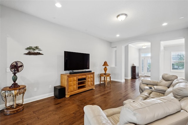 16415 Good Hearth Blvd, Clermont, FL 34711 - living room with arched walkways, dark wood-type flooring, and recessed lighting
