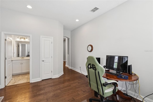 16415 Good Hearth Blvd, Clermont, FL 34711 - office with arched walkways, wood finished floors, and recessed lighting
