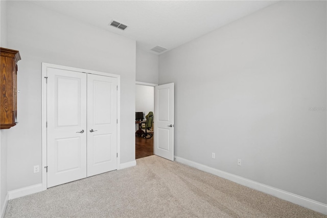 16415 Good Hearth Blvd, Clermont, FL 34711 - unfurnished bedroom featuring carpet flooring, a closet, and a desk