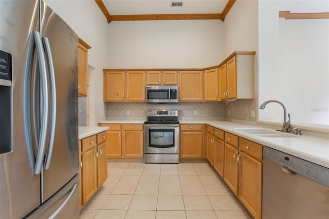 6029 Falconbridge Pl, Mount Dora, FL 32757 - kitchen featuring stainless steel appliances, ornamental molding, tasteful backsplash, light countertops, and light tile patterned floors