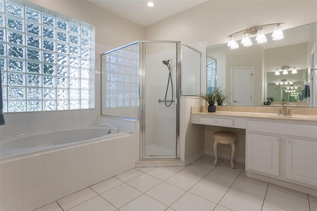 6029 Falconbridge Pl, Mount Dora, FL 32757 - full bath featuring tile patterned flooring, a garden tub, a shower stall, and vanity