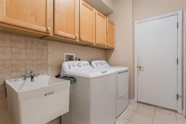 6029 Falconbridge Pl, Mount Dora, FL 32757 - laundry area featuring cabinet space, washer and dryer, and light tile patterned flooring