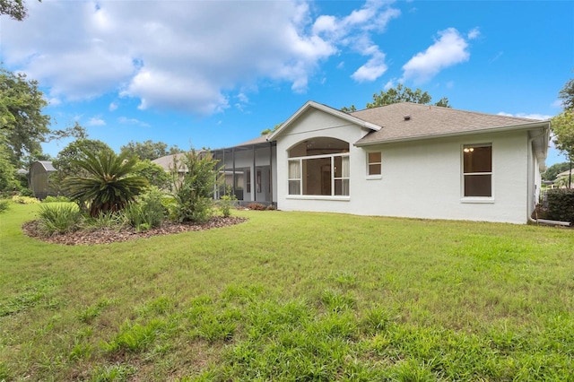6029 Falconbridge Pl, Mount Dora, FL 32757 - back of house featuring a lawn, stucco siding, and a sunroom