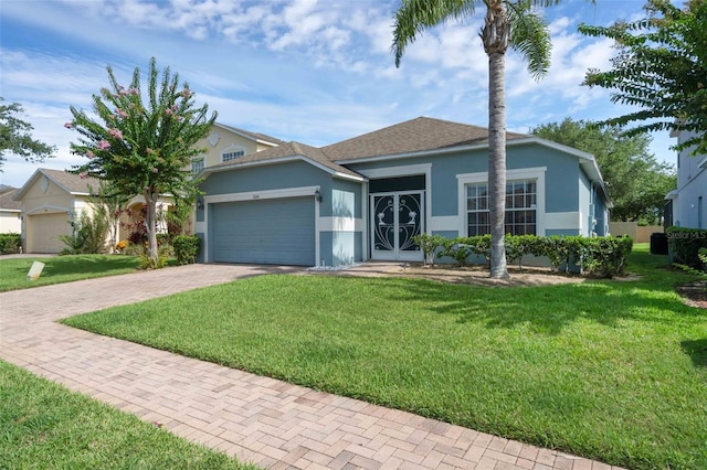 224 Highgate Park Blvd, Davenport, FL 33897 - ranch-style house featuring stucco siding, decorative driveway, an attached garage, and a front yard