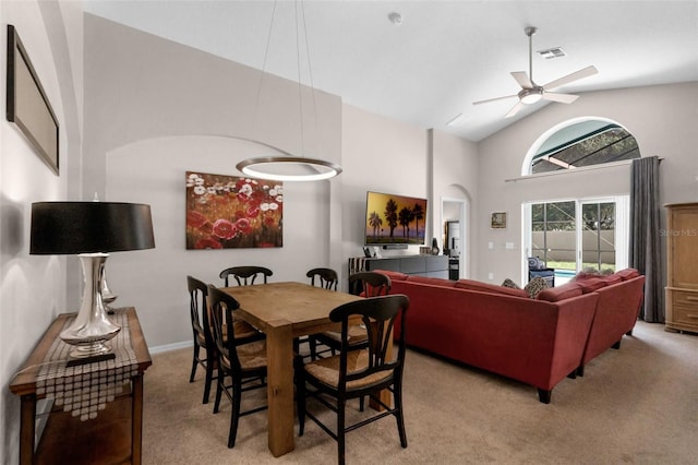 224 Highgate Park Blvd, Davenport, FL 33897 - carpeted dining area with high vaulted ceiling, ceiling fan, and arched walkways