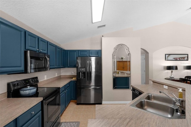 224 Highgate Park Blvd, Davenport, FL 33897 - kitchen featuring appliances with stainless steel finishes, lofted ceiling, blue cabinetry, arched walkways, and light tile patterned floors